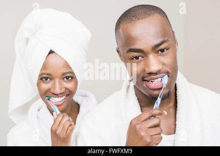 Young couple brushing teeth Stock Photo