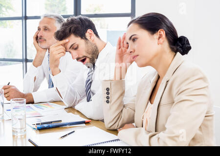 Business colleagues getting bored in a meeting Stock Photo