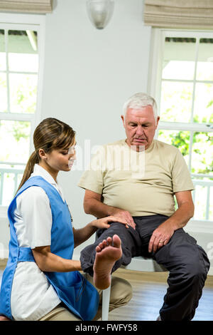 Nurse assisting senior man Stock Photo