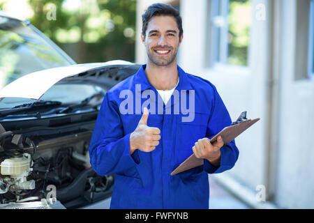 Portrait of confident engineer showing thumbs up Stock Photo