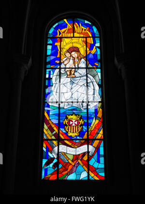 Stained glass window depicting Maria de La Merced (Virgin of Mercy) in La Almudena cathedral in Madrid, Spain Stock Photo