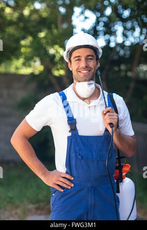 Portrait of confident insecticide worker Stock Photo
