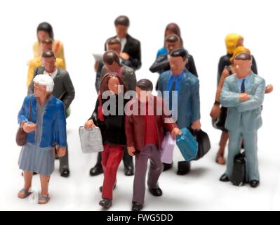 Crowdfunding concept with miniature figurines on a white background Stock Photo