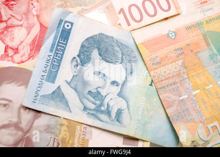 Nikola Tesla 100 dinar bill in the pile of Serbian dinars bills. Stock Photo
