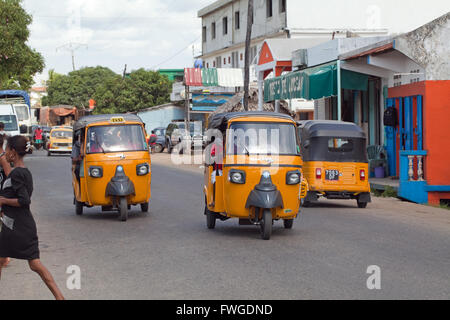 Tuk Tuk Yellow Taxi Vehicles.  Sambava.  Sava Region. Northeast Madagascar. Stock Photo