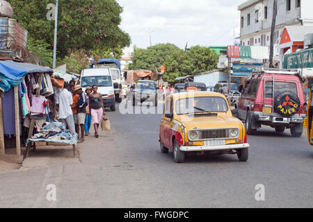 High Street, roadside stalls and vehicles.  Sambava.  Sava Region. Northeast Madagascar. Stock Photo