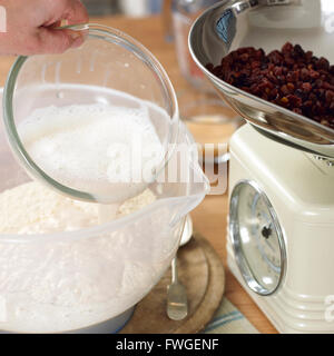 In the kitchen doing the preparation for baking hot cross buns. Stock Photo