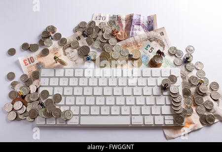 Crowd funding concept image showing how people can come together to raise funds  using the internet Stock Photo