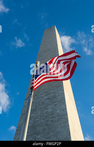 American flag in front of the Obelisk of the Washington Monument at the Mall,  Washington, District of Columbia, USA Stock Photo