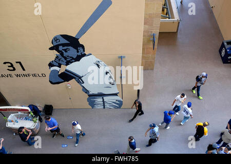 San Diego Padres' Hall of Fame pitcher Trevor Hoffman, left, hugs Padres'  Mark Kotsay, right, after he presented a custom surfboard to Kotsay before  a baseball game against the Arizona Diamondbacks on