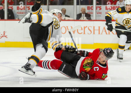 Chicago, Illinois, USA. 03rd Apr, 2016. - Blackhawk #19 Jonathan Toews runs into Bruin #63 Brad Marchand during the National Hockey League game between the Chicago Blackhawks and the Boston Bruins at the United Center in Chicago, IL. Mike Wulf/CSM/Alamy Live News Stock Photo