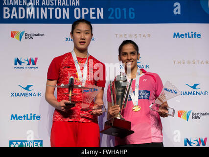 Sydney, Australia. 12th June, 2016. Saina Nehwal of India (R) and Sun Yu of China pose during the awarding ceremony after women's singles final match at Australian Badminton Open 2016 in Sydney, Australia, June 12, 2016. Nehwal won 2-1 and claimed the title of the event. © Zhu Hongye/Xinhua/Alamy Live News Stock Photo