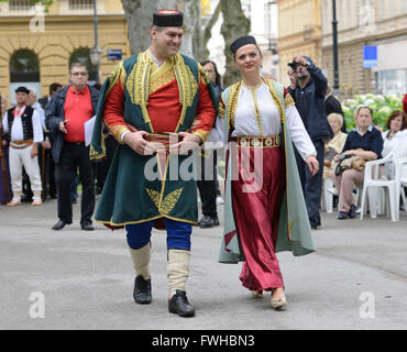 Zagreb, Croatia. 12th June, 2016. Participants dressed in Montenegrin folk costumes perform during the annual Day of National Minorities at Zrinjevac Park in Zagreb, Croatia, June 12, 2016. Members of 18 national minorities settled in Croatia presented their traditional customs, food and folklore to tourists and locals on Sunday. Credit:  Miso Lisanin/Xinhua/Alamy Live News Stock Photo
