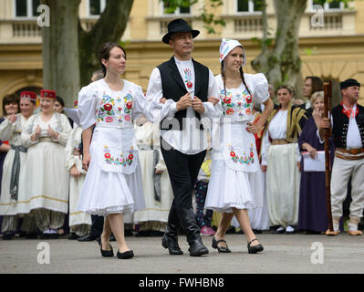 Zagreb, Croatia. 12th June, 2016. Participants dressed in Hungarian folk costumes perform during the annual Day of National Minorities at Zrinjevac Park in Zagreb, Croatia, June 12, 2016. Members of 18 national minorities settled in Croatia presented their traditional customs, food and folklore to tourists and locals on Sunday. Credit:  Miso Lisanin/Xinhua/Alamy Live News Stock Photo