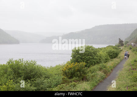 People walking along a path in Elan valley Wales Stock Photo