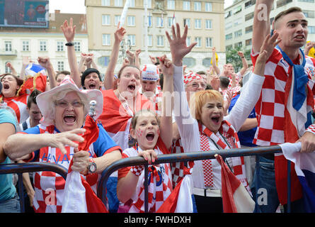 (160613) -- ZAGREB, June 13, 2016 (Xinhua) -- Croatian football fans cheer as they watch the Euro 2016 football match between Croatia and Turkey in a fan zone at central square of Zagreb, Croatia, June 12, 2016. (Xinhua/Miso Lisanin) Stock Photo