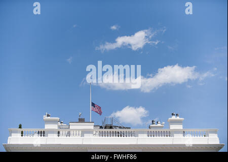 June 12, 2016 - Washington, District of Columbia, United States of America - The American flags that fly over the White House in Washington, DC are lowered to half staff following United States President Barack Obama's remarks to reporters in the Brady Press Briefing Room in Washington, District of Columbia, U.S., on Sunday, June 12, 2016, about the deadly shooting the night before in a gay nightclub in Orlando FL. Approximately 50 people were killed and at least 53 more were injured in what appears to be the deadliest mass shooting in U.S. history. Credit: Pete Marovich/Pool via CNP (Credi Stock Photo