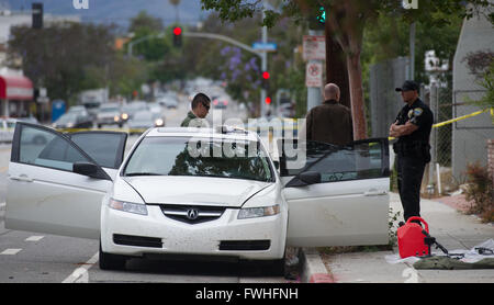 Los Angeles, USA. 12th June, 2016. Police search a car in Santa Monica, California, the United States, June 12, 2016. Santa Monica police arrested a man armed with a gun and seized a car with explosives here on Sunday morning hours before a gay pride parade in West Hollywood. Credit:  Yang Lei/Xinhua/Alamy Live News Stock Photo