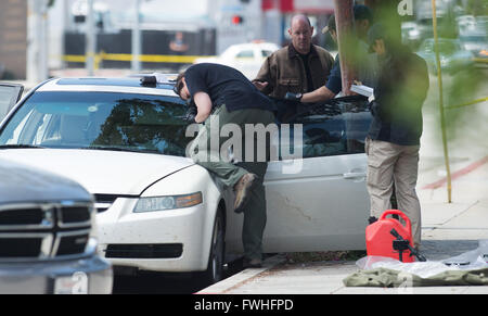 Los Angeles, USA. 12th June, 2016. Police work on the scene in Santa Monica, California, the United States, June 12, 2016. Santa Monica police arrested a man armed with a gun and seized a car with explosives here on Sunday morning hours before a gay pride parade in West Hollywood. Credit:  Yang Lei/Xinhua/Alamy Live News Stock Photo