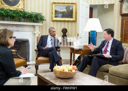 Washington DC, USA. 12th June, 2016. U.S President Barack Obama receives an update from FBI Director James Comey and Homeland Security Advisor Lisa Monaco on the mass shooting in Orlando at the Oval Office of the White House June 12, 2016 in Washington, DC. A gunman allegedly tied to Islamic radicals shot dead 50 people at a Gay Club in Orlando, Florida. Credit:  Planetpix/Alamy Live News Stock Photo