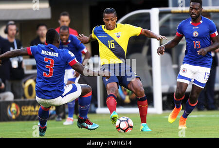 New Jersey, USA. 12th June, 2016. Luis Valencia (C) of Ecuador vies with Mechack Jerome (L) of Haiti during their Copa America Centenario football tournament match in East Rutherford, New Jersey, United States, on June 12, 2016. Credit:  Qin Lang/Xinhua/Alamy Live News Stock Photo