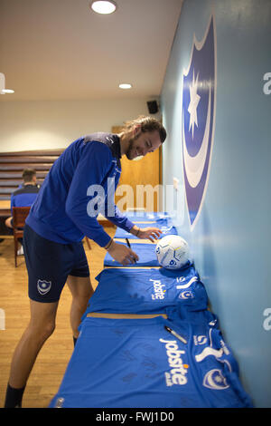 Portsmouth Football Club, Christian Burgess signing shirts at the Roko Health Club on Copnor Road, Portsmouth, England Stock Photo