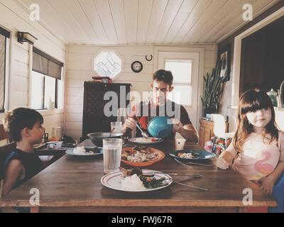 Father With Children Having Lunch At Home