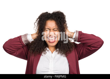 Cut out image of a young smiling woman with brown curly hair (afro) who is crying while covering her ears with her hands. Stock Photo