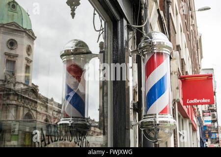 Barbers shops and poles in London's Smithfield area, UK Stock Photo