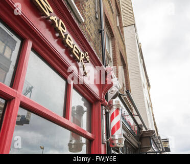 Barbers shops and poles in London's Smithfield area, UK Stock Photo