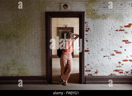 Woman posing in doorway, Fort Warren, Georges Island, Boston, Massachusetts Stock Photo