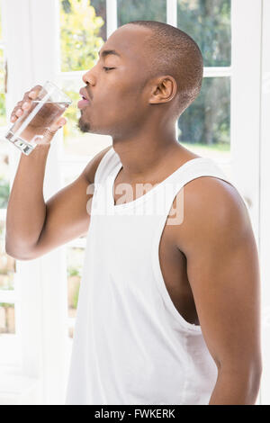 Young man drinking water Stock Photo