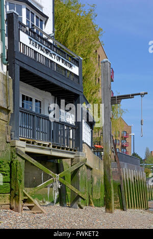 Famous Riverside Prospect of Whitby historic public house River Thames foreshore at low tide with hangmans noose Wapping East End of London England UK