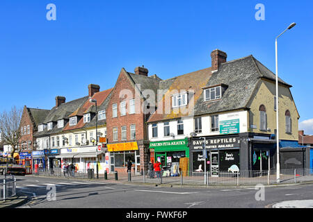 Shopping parade on LCC Becontree housing estate flats above & Reptile shop next to Pet & Aquatics store east London borough Barking and Dagenham UK Stock Photo