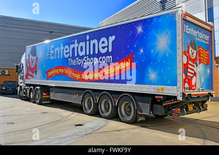 Supply chain logistics Entertainer Toy Shop hgv articulated delivery lorry truck and trailer parked up at back of toy shop in Romford East London UK Stock Photo