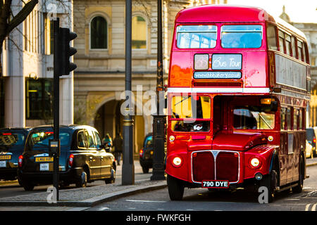 Traditional London Routemaster Red Bus and Black cab near Trafalgar square Stock Photo