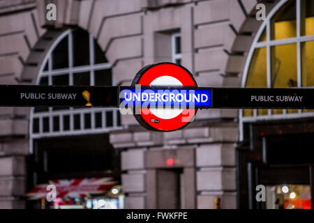 Illuminated London underground roundel tube sign at night Stock Photo ...