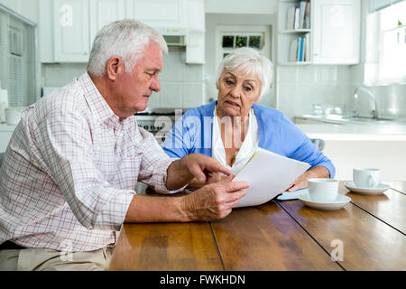 Retired couple discussing with documents Stock Photo