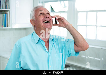 Happy senior man talking on phone Stock Photo
