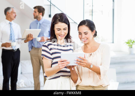 Businesswomen are looking at their notes Stock Photo