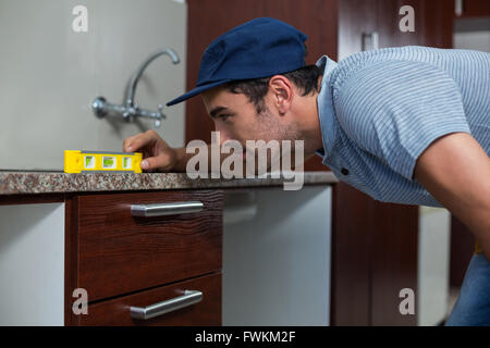 Man using spirit level Stock Photo