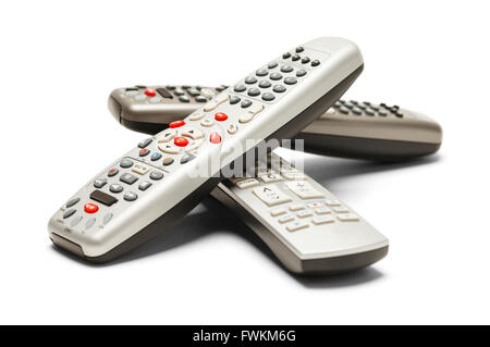 Pile of TV Remote Controls Isolated on White Background. Stock Photo