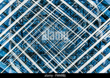 Blue, Black and White abstract pattern created using multiple exposures of an architectural detail. Stock Photo