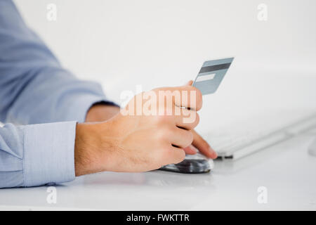 Mans hand holding a credit card Stock Photo