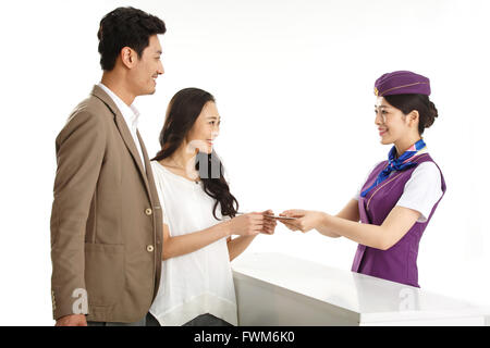 Young female flight attendants for customers to pass a passport Stock Photo