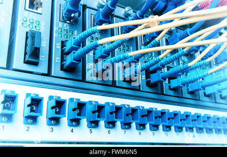 Fiber optic connecting on core network swtich Stock Photo
