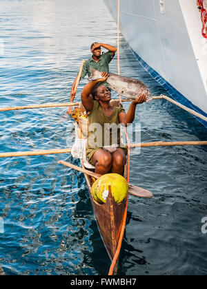 Men fishing from an outrigger canoe, in reservoir lake, Polonnaruwa,  Central Province, Sri Lanka, Asia Stock Photo - Alamy