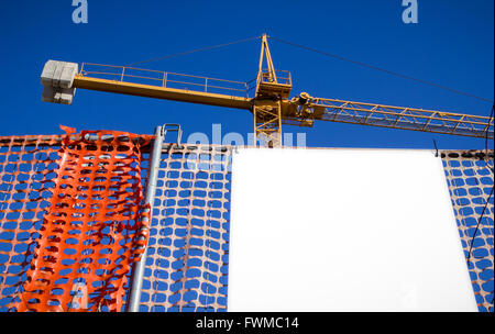 Blank billboard customizable on the construction site. Stock Photo