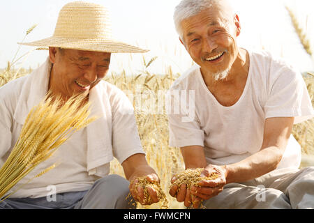 Portrait of two farmers in field Stock Photo