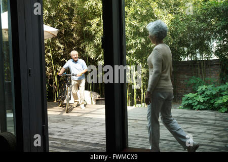 Senior couple in yard Stock Photo